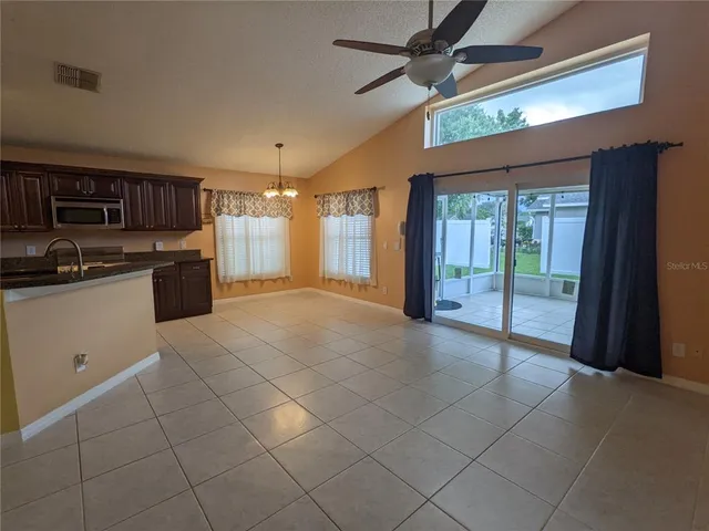 a large kitchen with cabinets and stainless steel appliances