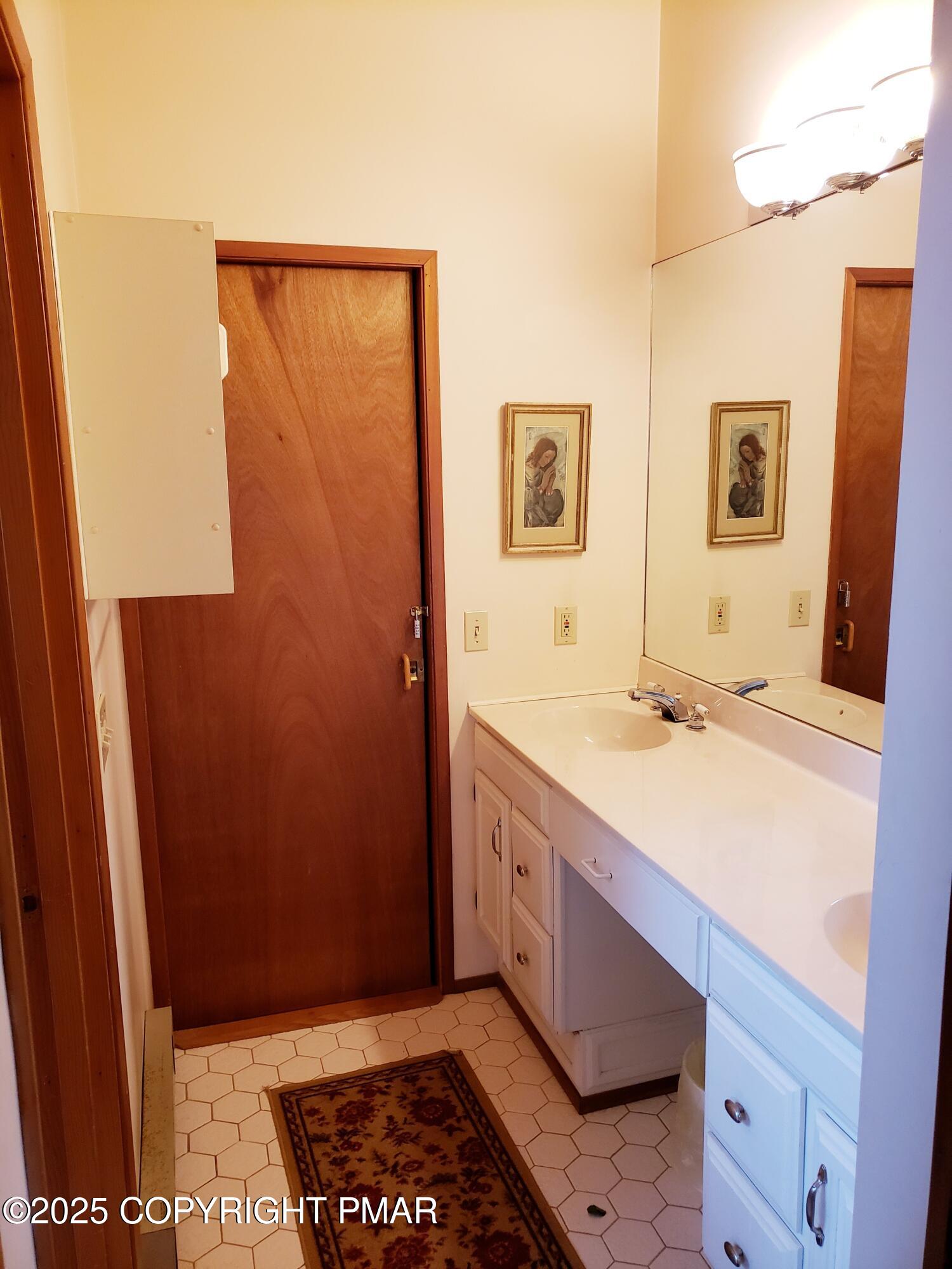 3530 Spruce Cabin Road Canadensis, PA 18325 - Photo 13 of 19 a bathroom with a sink and a mirror