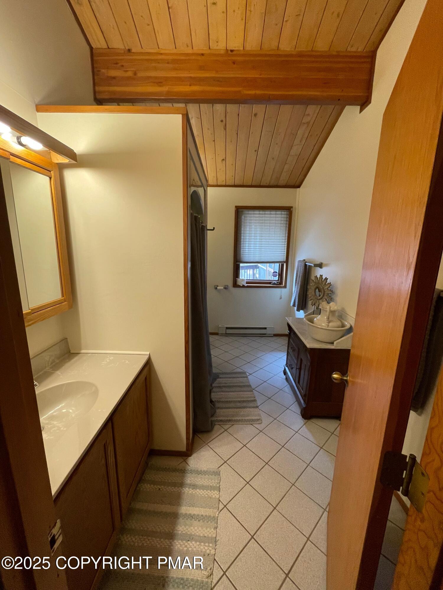 3530 Spruce Cabin Road Canadensis, PA 18325 - Photo 17 of 19 a bathroom with a sink a toilet and shower