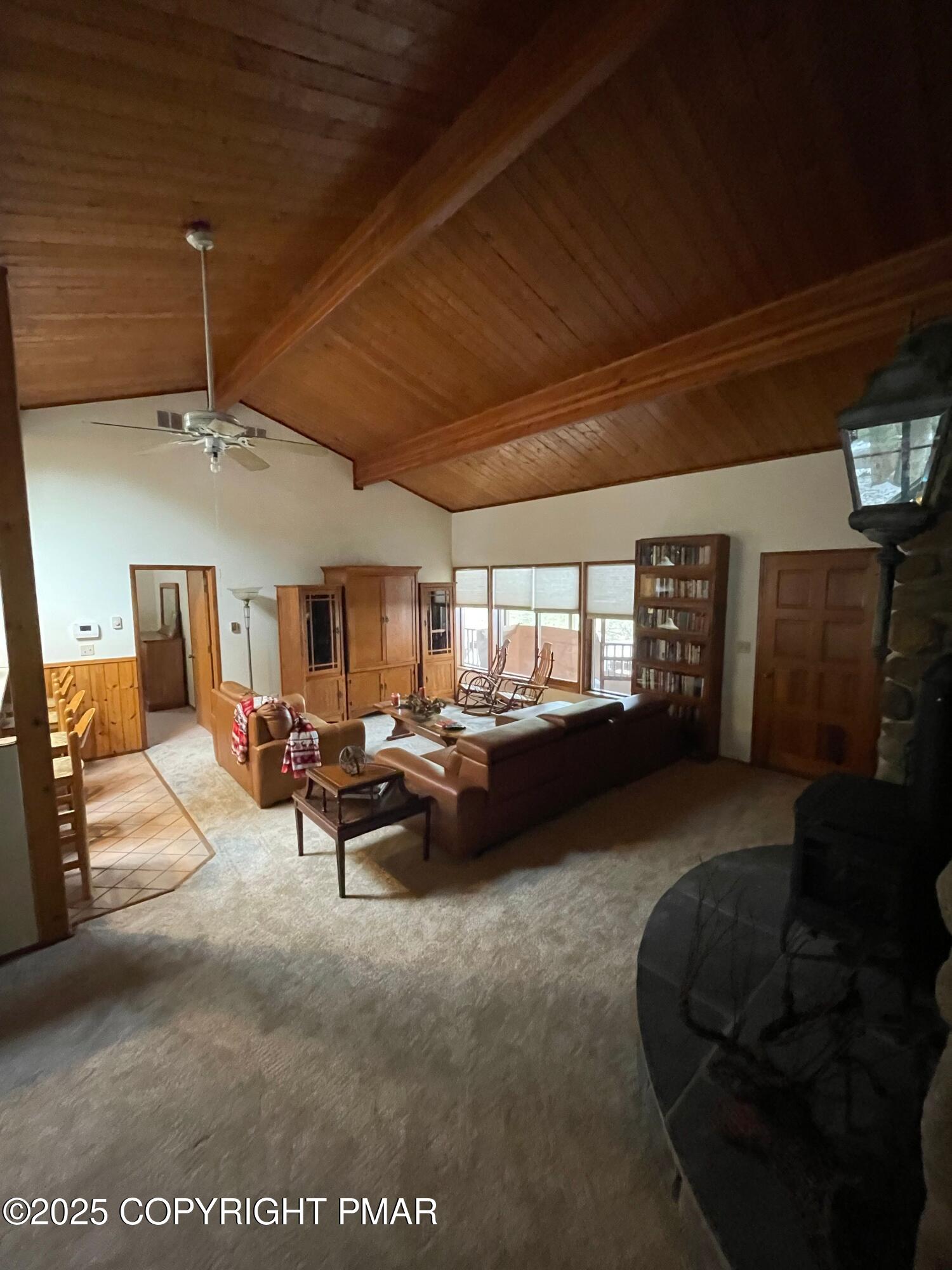 3530 Spruce Cabin Road Canadensis, PA 18325 - Photo 5 of 19 a living room with furniture and a fireplace