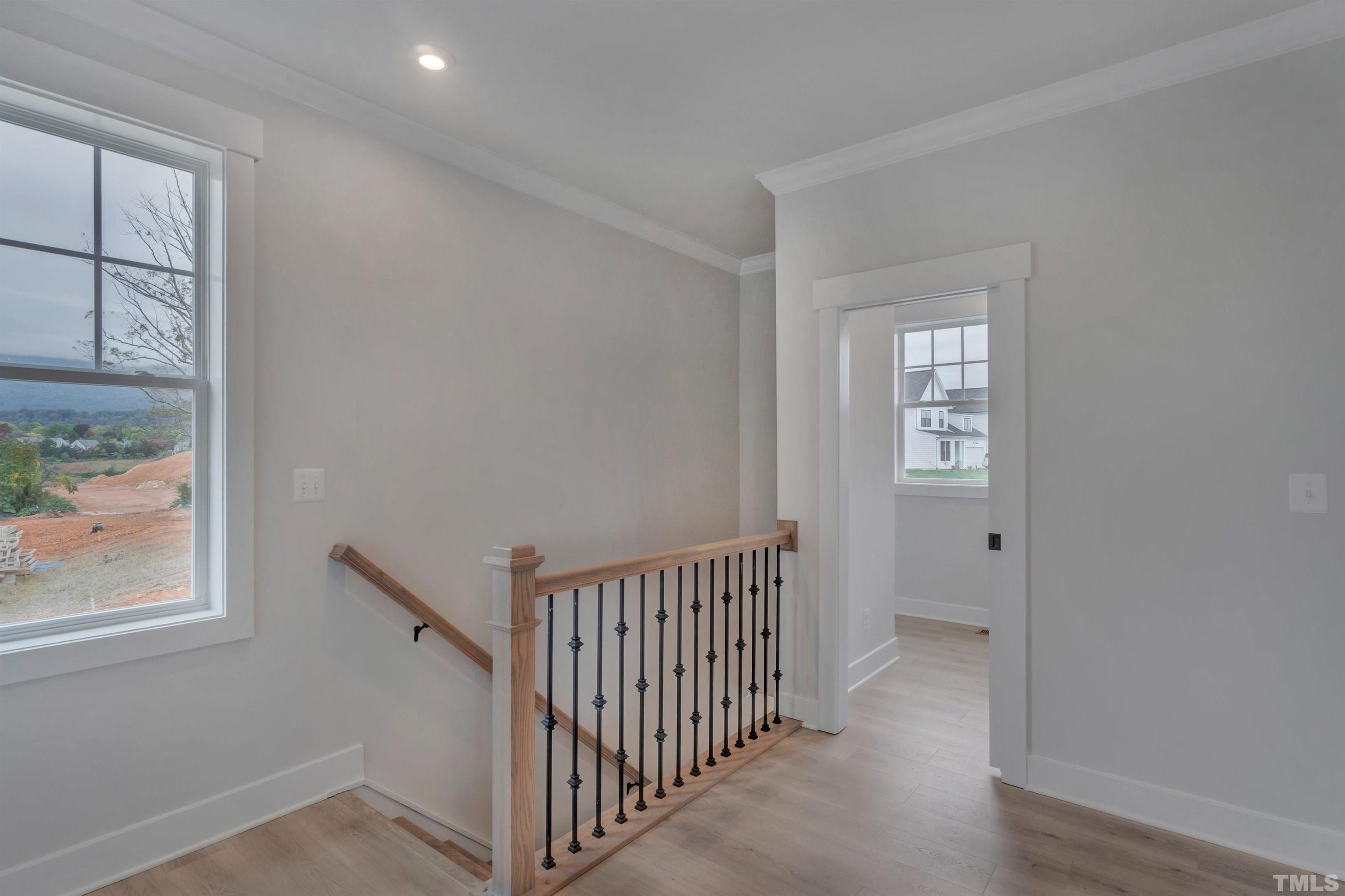 188 Dunloe Loop Raleigh, NC 27603 - Photo 12 of 13 a view of a hallway with windows