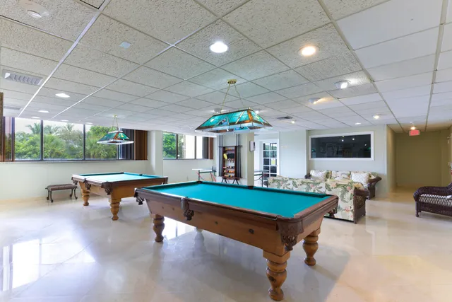 a view of an apartment with a swimming pool