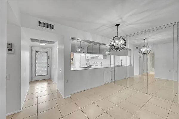 a view of a kitchen with a sink and cabinets