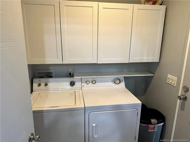 a view of a lake with sitting area and garden