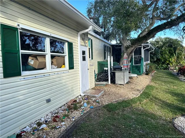 a view of a chairs and table in the balcony