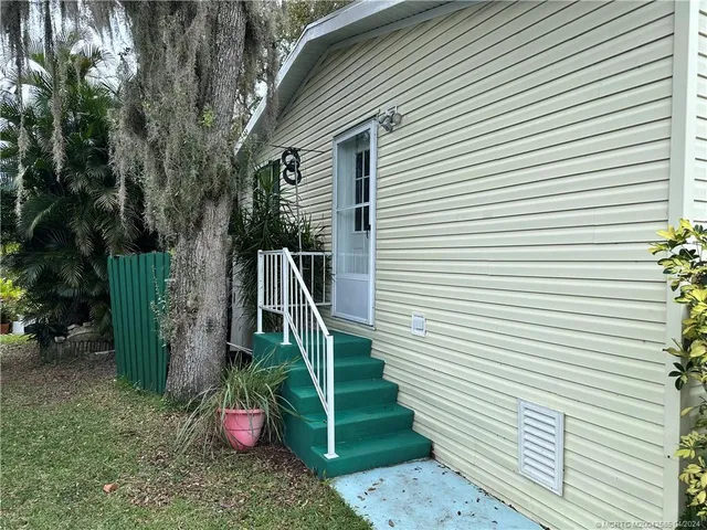 swimming pool with wooden bench and lake view