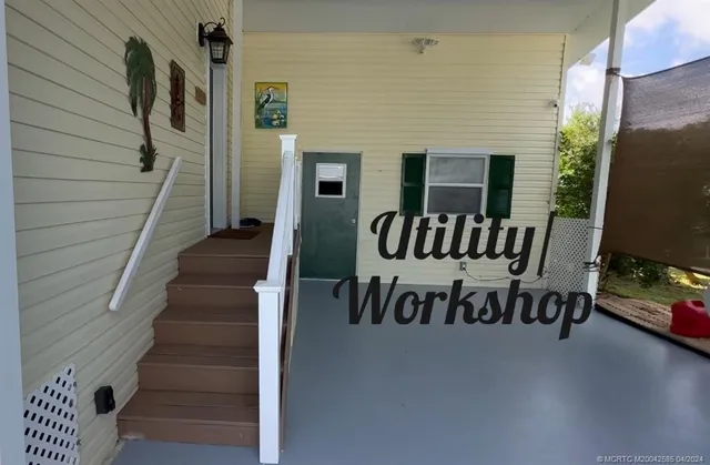 a view of a patio with table and chairs
