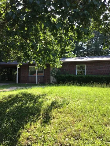 a view of a house with a garden