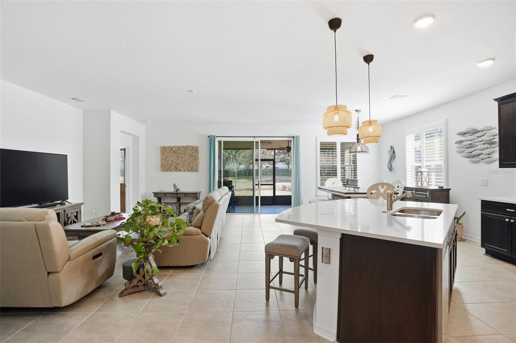 5365 Cappleman Loop Brooksville, FL 34601 - Photo 11 of 52 a large living room with furniture and a flat screen tv