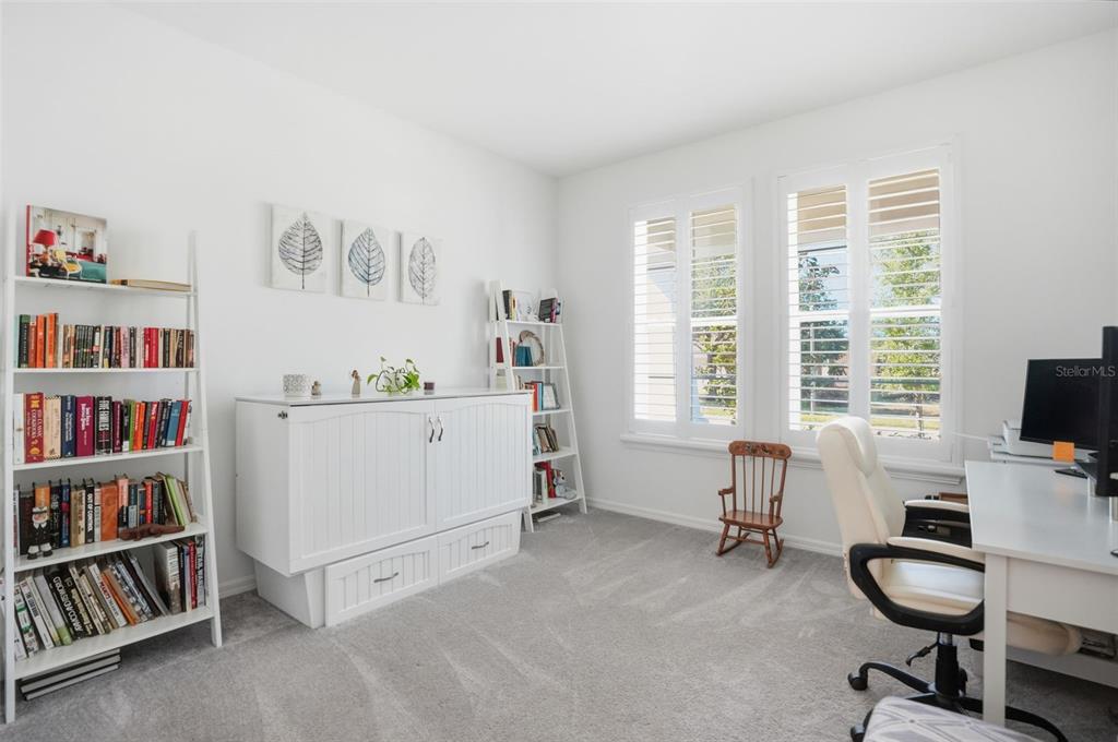 5365 Cappleman Loop Brooksville, FL 34601 - Photo 29 of 52 a view of a workspace with a window and lounge chair