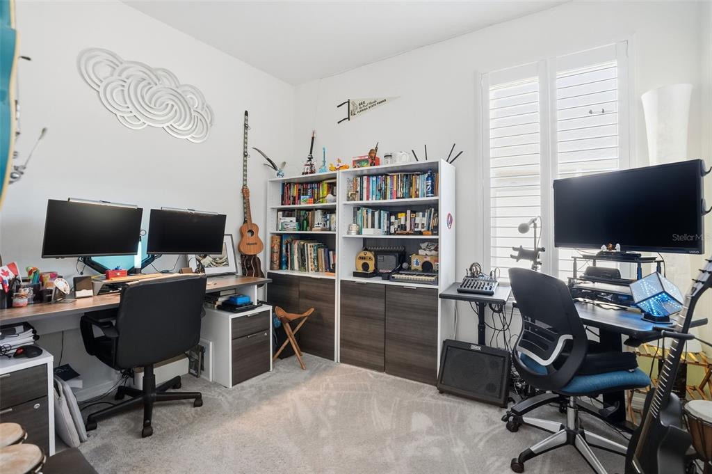 5365 Cappleman Loop Brooksville, FL 34601 - Photo 34 of 52 a view of a workspace with a window and lounge chair