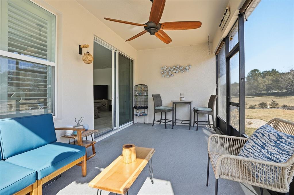 5365 Cappleman Loop Brooksville, FL 34601 - Photo 38 of 52 a living room with furniture and a floor to ceiling window