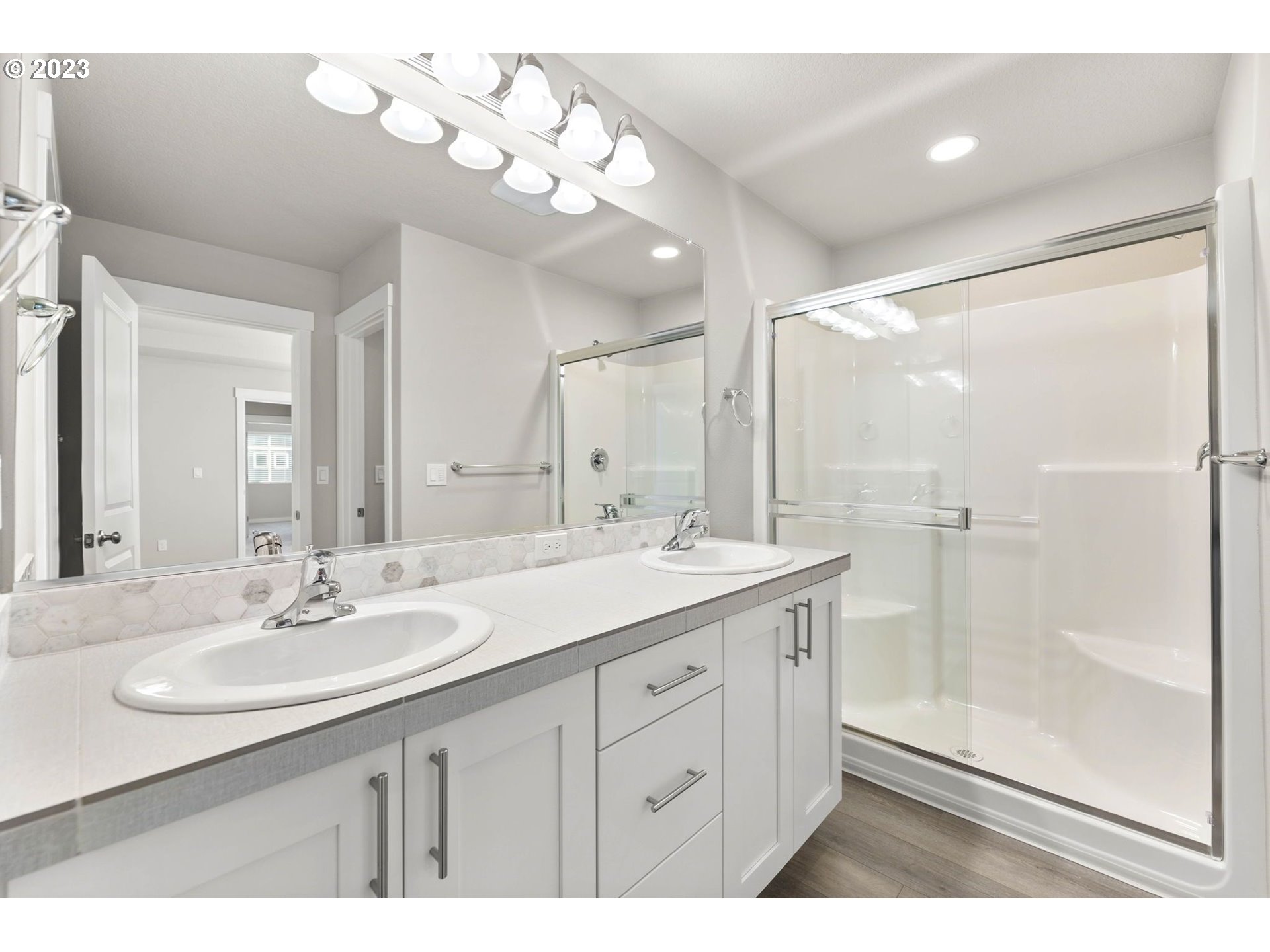 3147 South Kodiak Street, Unit LT798 Cornelius, OR 97113 - Photo 16 of 24 a bathroom with a sink double vanity granite tub and a mirror