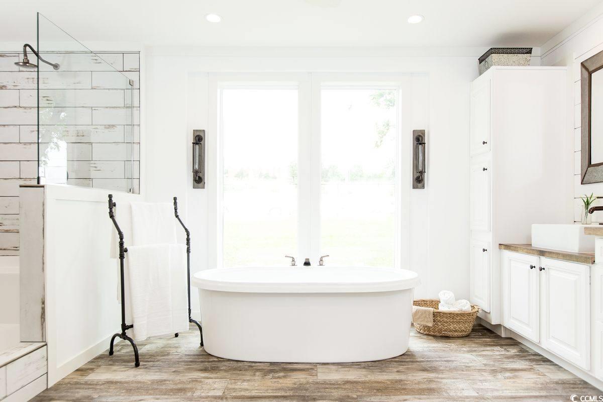 3702 Horse Pen Bay Road Aynor, SC 29511 - Photo 4 of 11 Full bath featuring a freestanding tub, light wood-style floors, a walk in shower, vanity, and recessed lighting