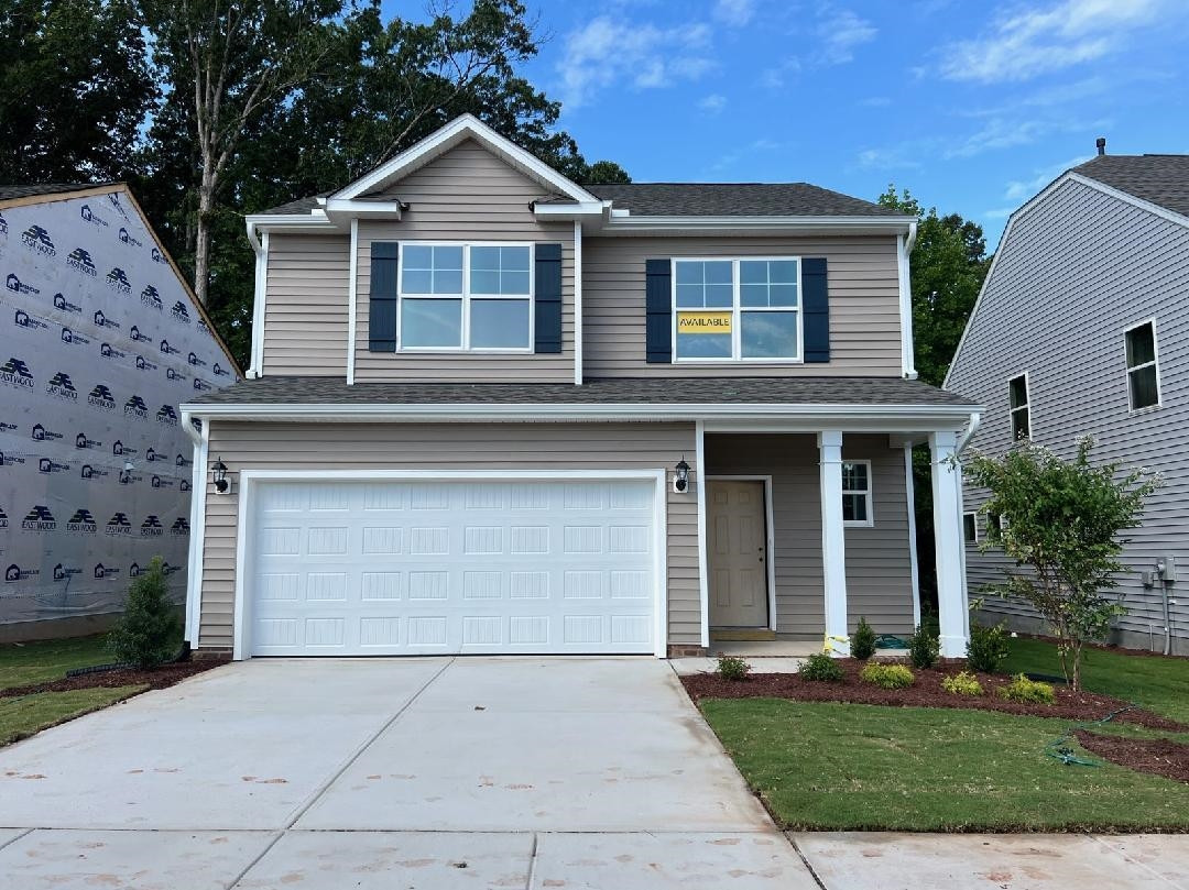 2209 Seneca Road Raleigh, NC 27604 - Photo 2 of 21 a front view of a house with yard and parking