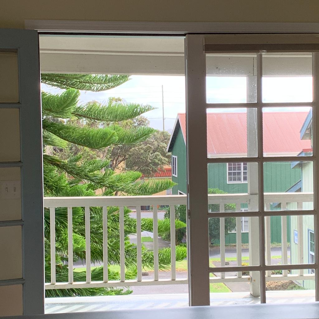 65-1241 Opelo Road, Unit 7 Kamuela, HI 96743 - Photo 6 of 14 a view of a room that has a bed and a large window