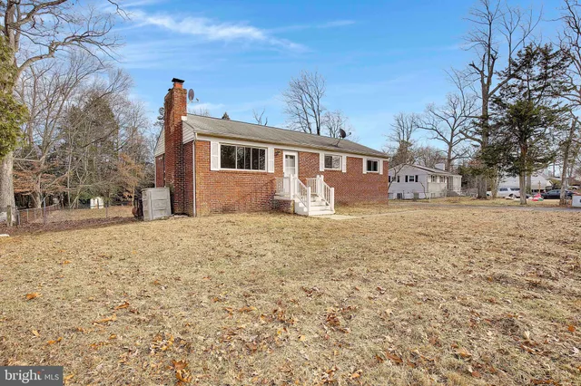 a house with trees in front of it
