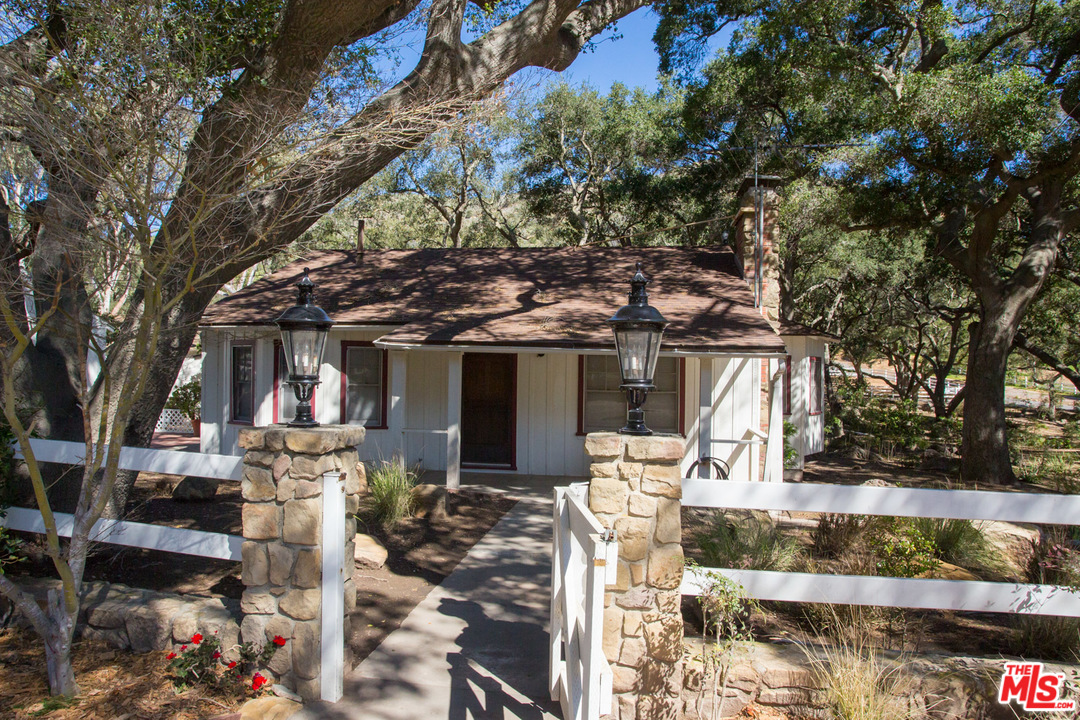1753 Hidden Valley Road Thousand Oaks, CA 91361 - Photo 21 of 43 a front view of a house with a tree