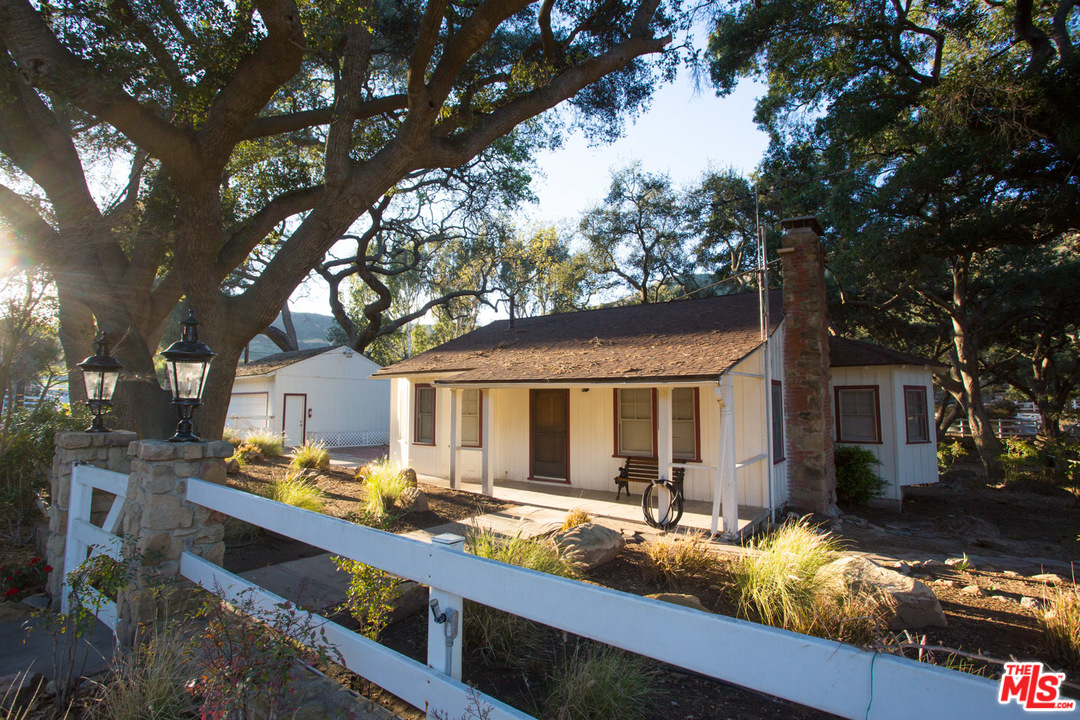 1753 Hidden Valley Road Thousand Oaks, CA 91361 - Photo 34 of 43 a view of house with yard outdoor seating and covered with trees