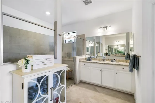 a kitchen with a sink a stove and cabinets