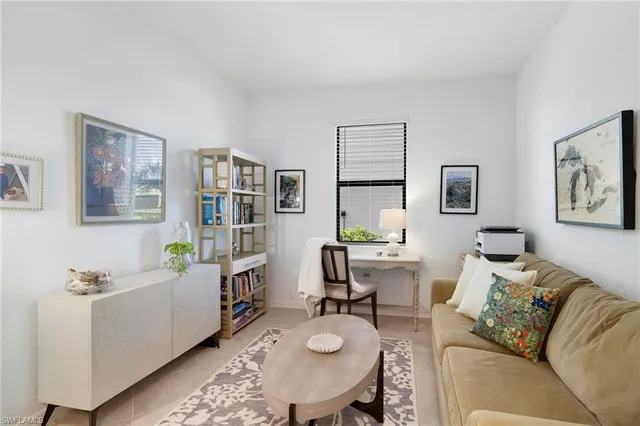 a living room with furniture and a table
