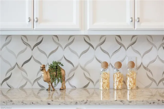 a white vase with flowers on it