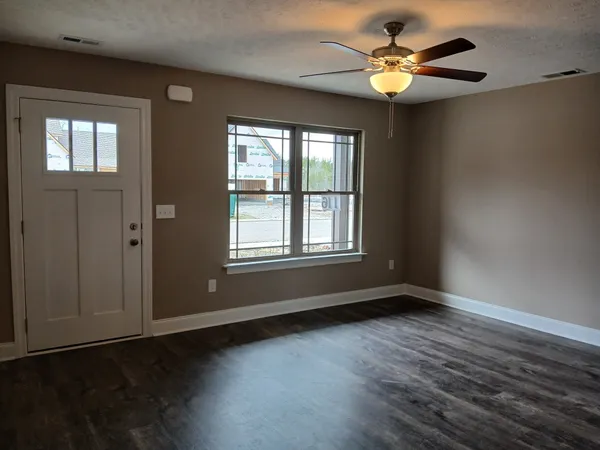 a view of an empty room and window