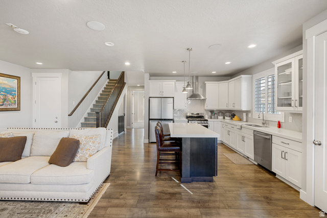 2745 Red Barn Road South Heber City, UT 84032 - Photo 51 of 51 Kitchen featuring open floor plan, glass insert cabinets, white cabinets, a kitchen island, and decorative light fixtures