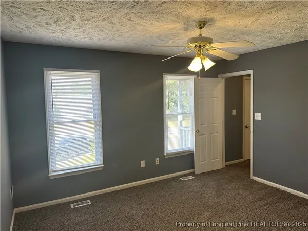 a bathroom with a sink toilet and mirror