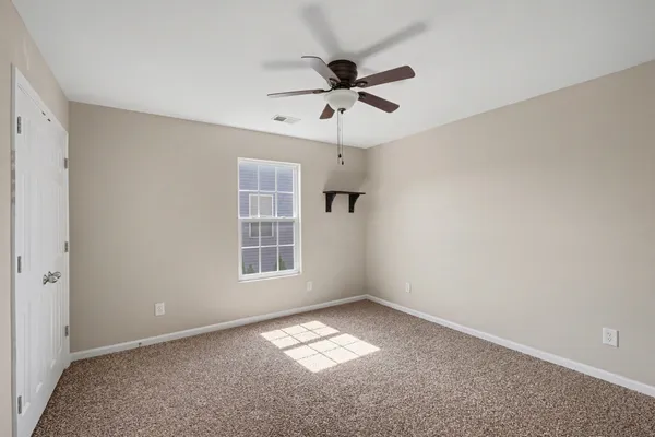 a view of empty room with windows