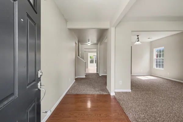 a view of hallway with livingroom