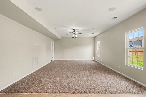 a view of an empty room with a window