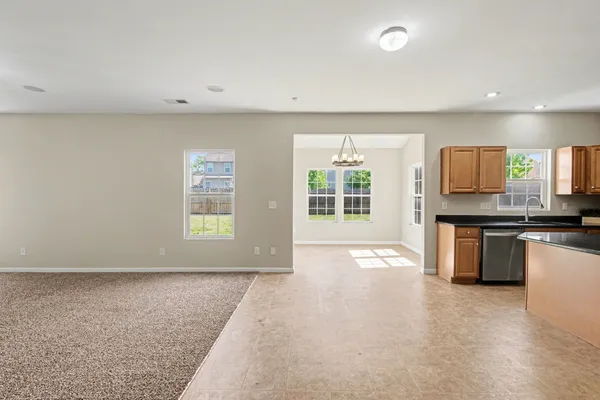 a view of a kitchen with a sink and a fireplace