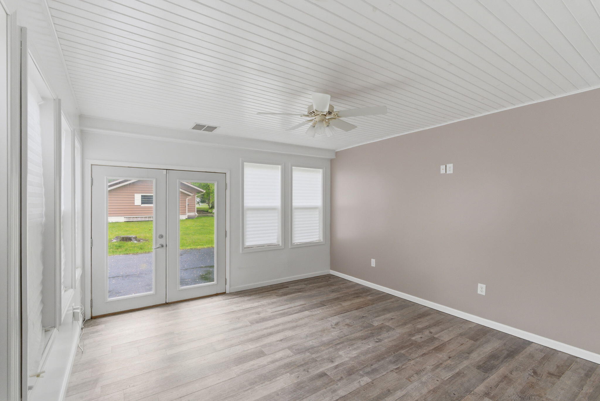829 Johnson Street, Unit A Porter, IN 46304 - Photo 14 of 21 wooden floor in an empty room with a window