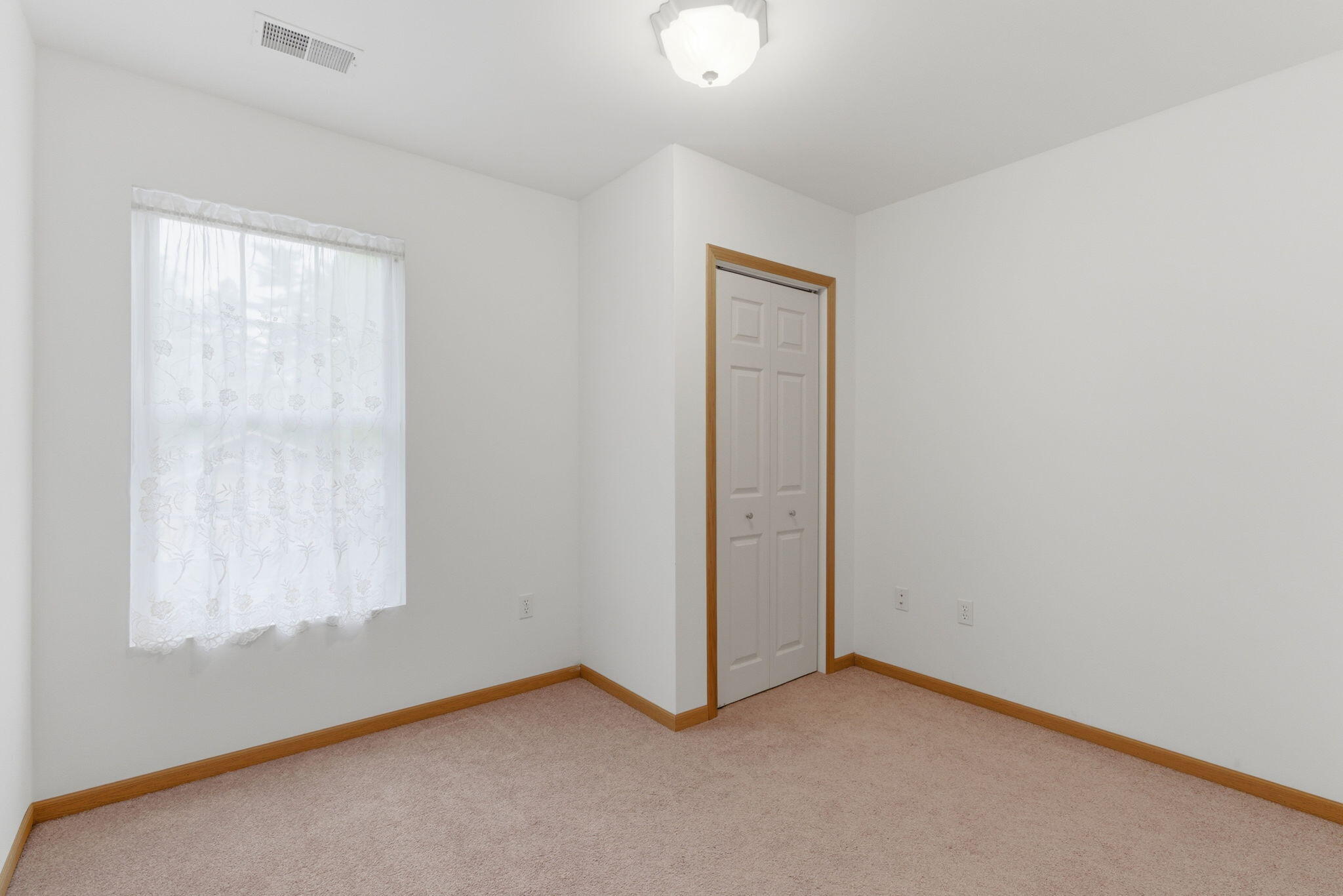829 Johnson Street, Unit A Porter, IN 46304 - Photo 17 of 21 an empty room with windows