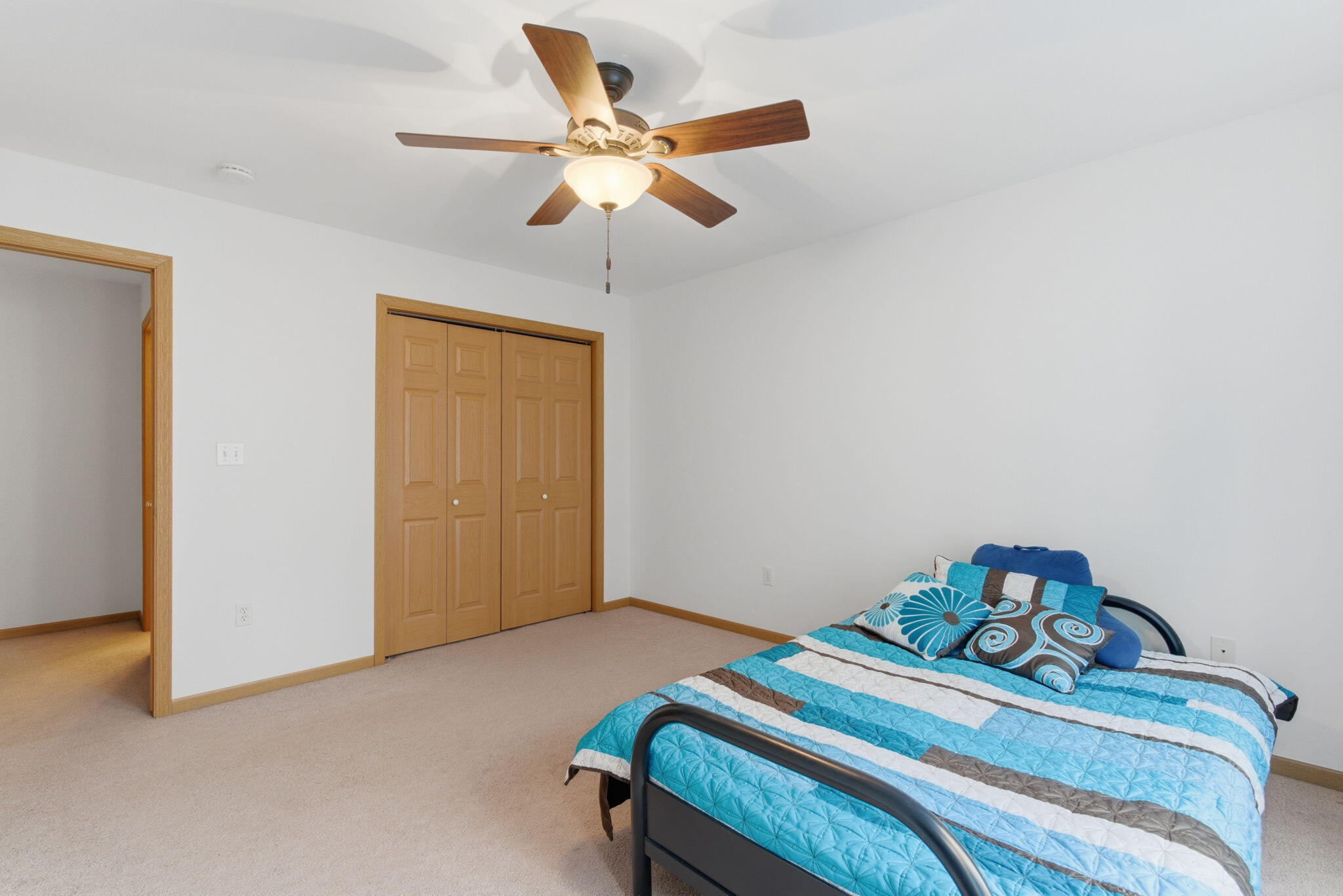 829 Johnson Street, Unit A Porter, IN 46304 - Photo 20 of 21 a bedroom with a bed and a ceiling fan