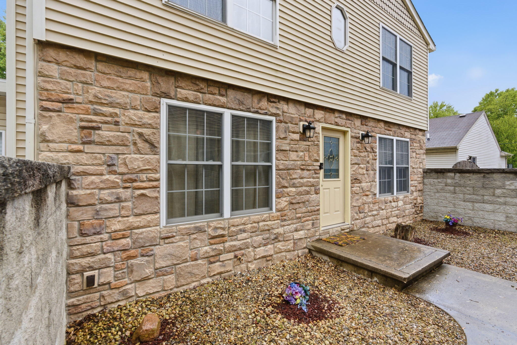 829 Johnson Street, Unit A Porter, IN 46304 - Photo 3 of 21 a front view of a house with a garden
