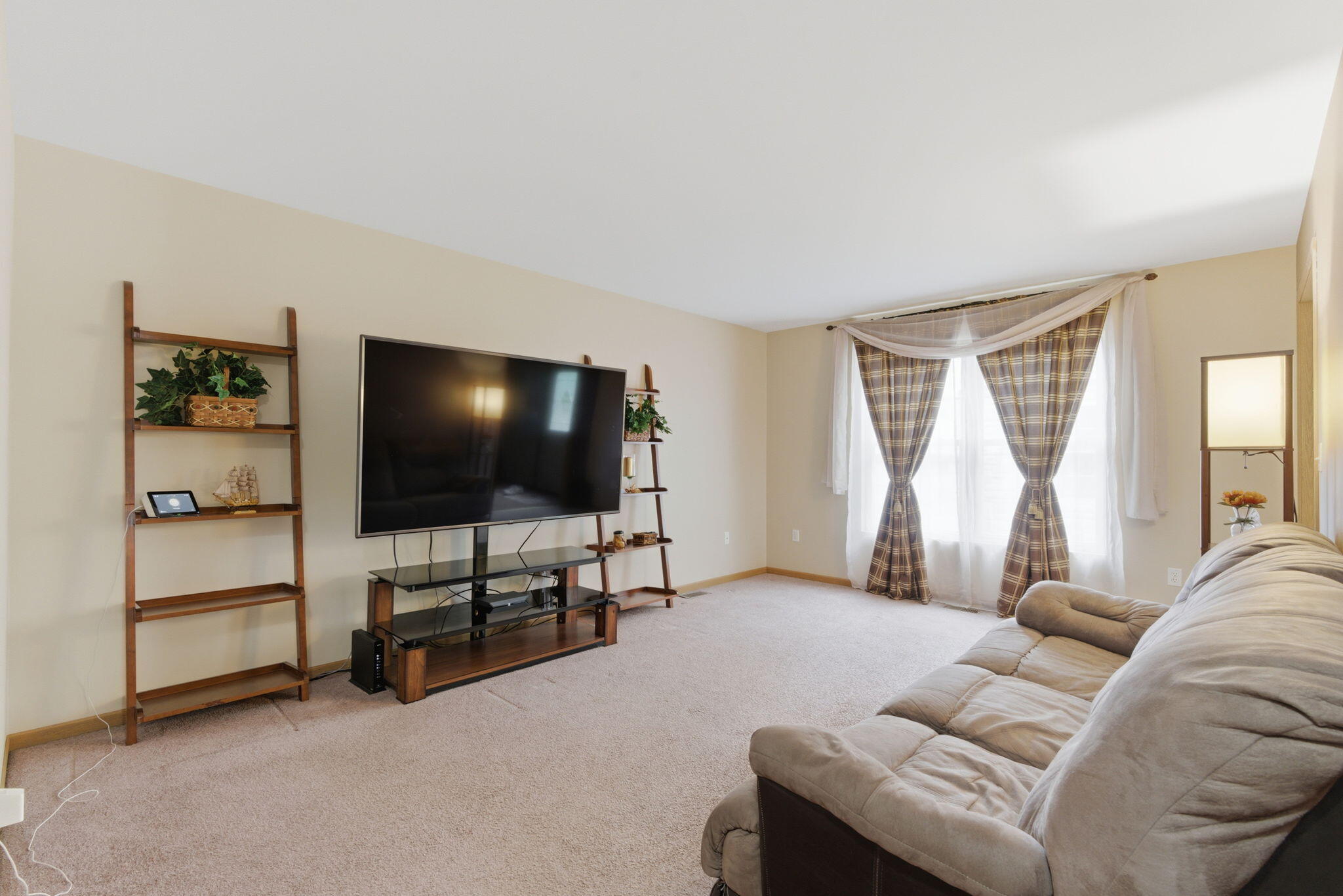 829 Johnson Street, Unit A Porter, IN 46304 - Photo 5 of 21 a living room with furniture and a flat screen tv