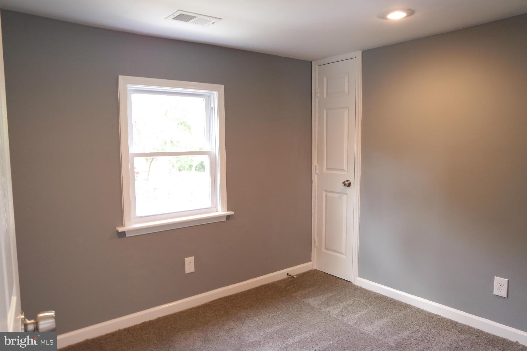 6716 Larkspur Road Morningside, MD 20746 - Photo 16 of 23 an empty room with windows