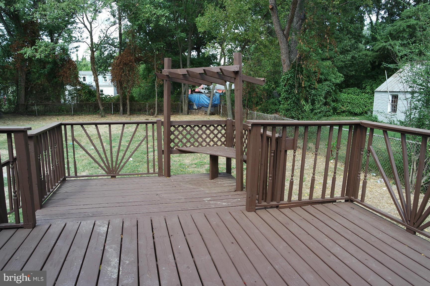6716 Larkspur Road Morningside, MD 20746 - Photo 19 of 23 a view of deck with wooden floor and fence