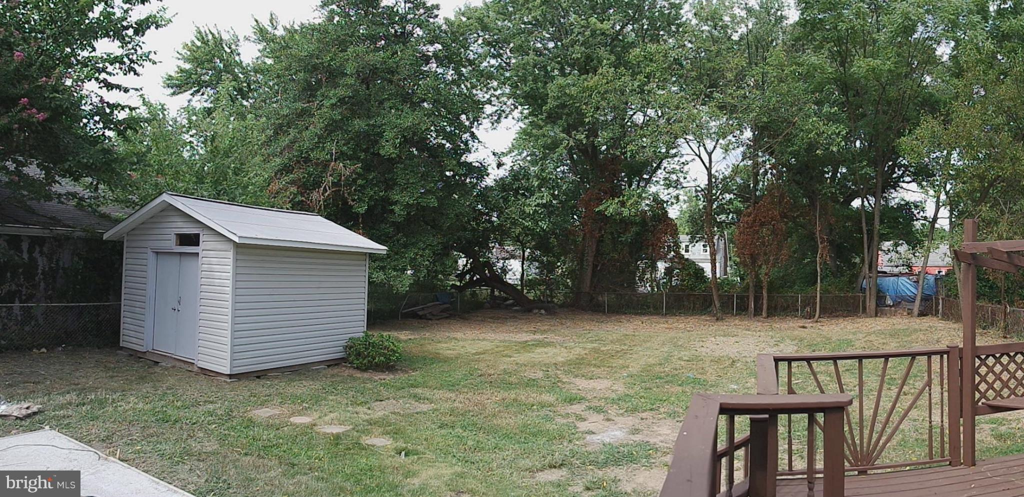 6716 Larkspur Road Morningside, MD 20746 - Photo 22 of 23 a view of backyard of house with seating space