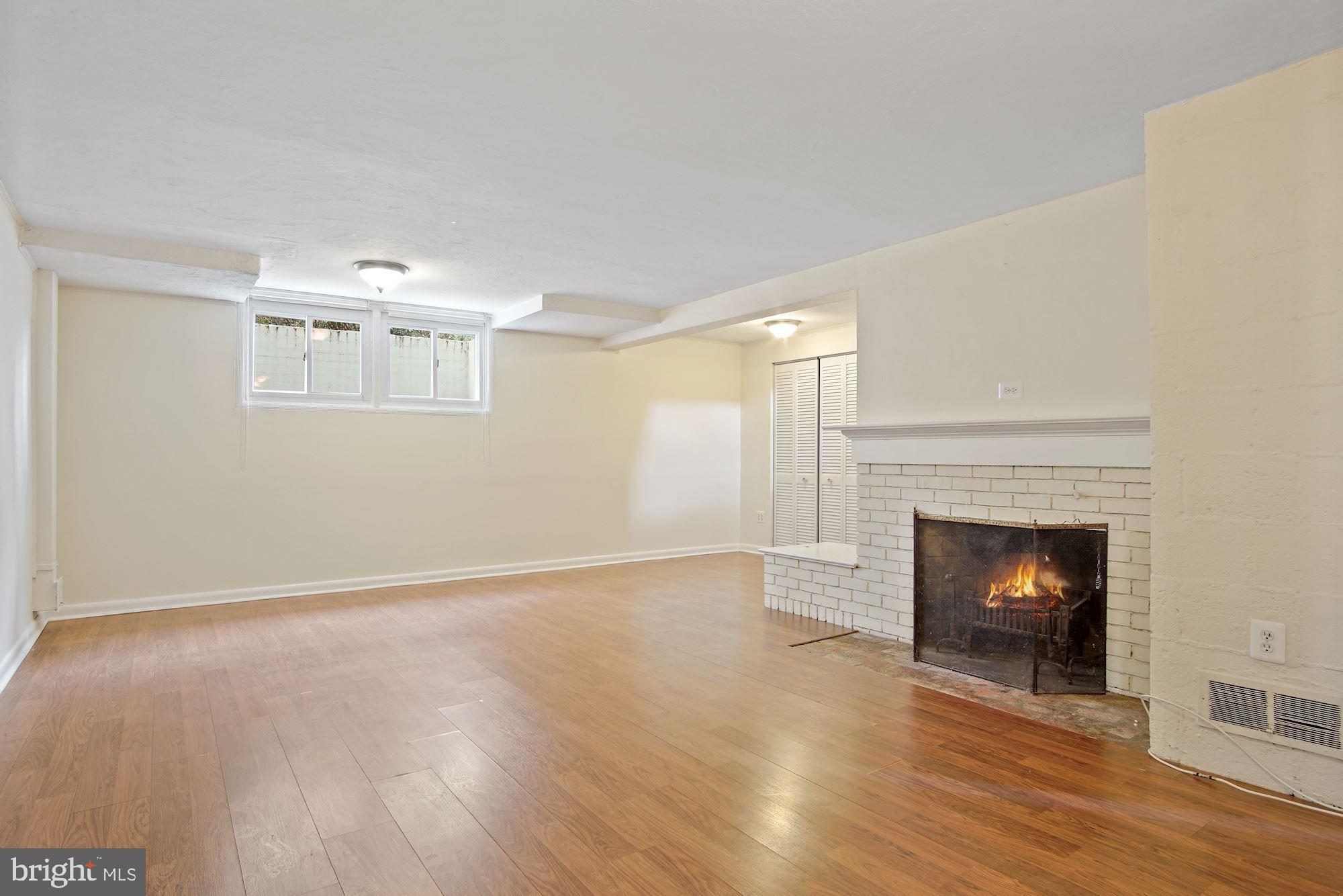 7807 Marion Lane Bethesda, MD 20814 - Photo 24 of 35 Lower level - great room with FP
