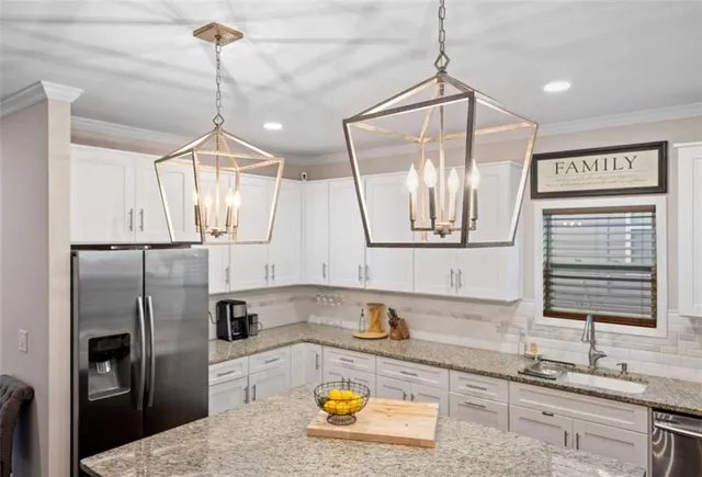 a bathroom with a granite countertop sink a mirror and shower