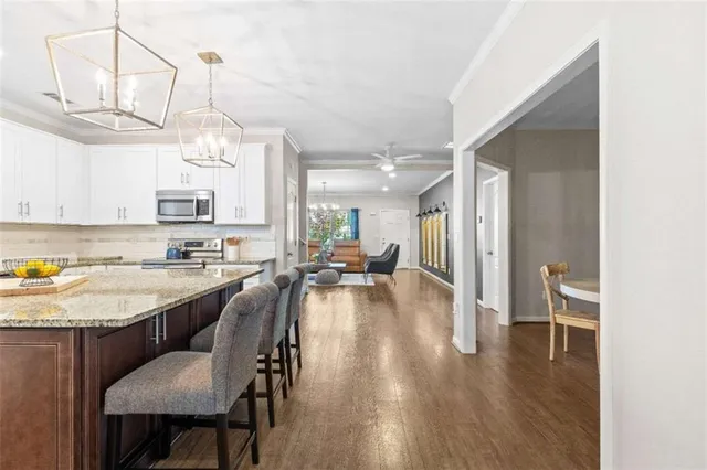 a view of walk in closet with clothes