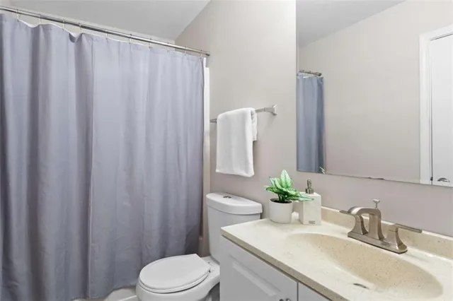 an aerial view of residential houses with outdoor space and river