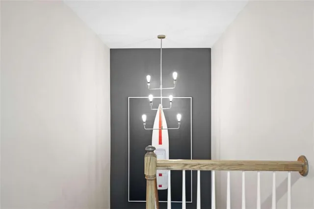 an aerial view of a house with a yard and lake view