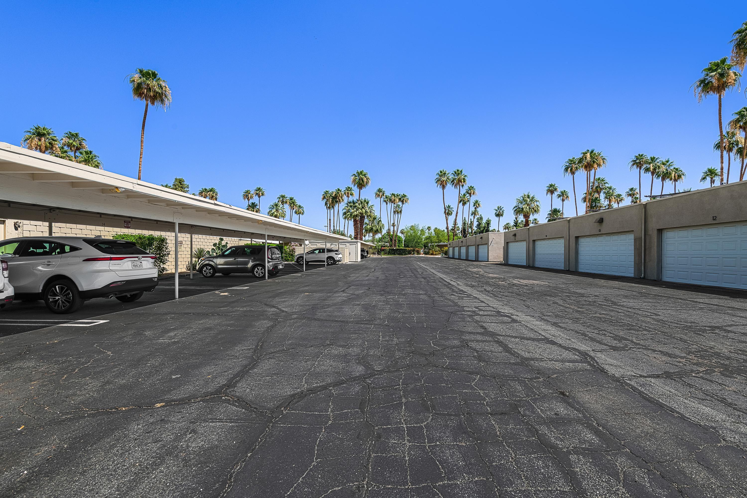 1855 Ramon Road, Unit 14 Palm Springs, CA 92264 - Photo 29 of 34 a view of a cars park on the side of a road