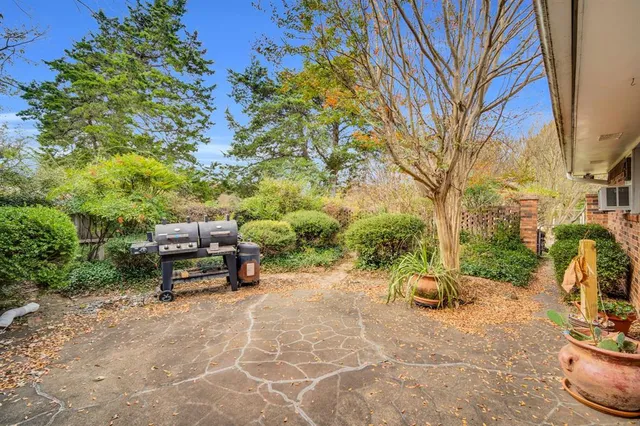 a view of a backyard with sitting area
