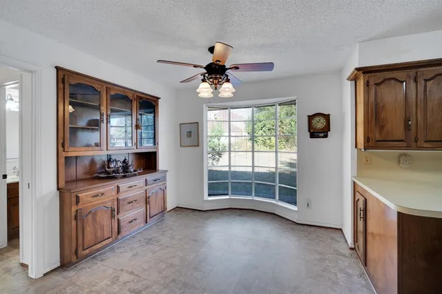a kitchen with granite countertop a stove and a sink