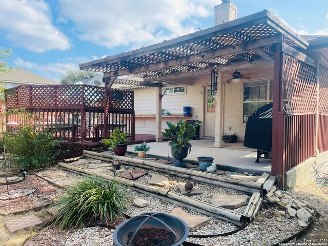 a building with glass top table and chairs